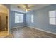 Spacious bedroom with light blue walls and wood-look flooring at 4714 E Paso Trl, Phoenix, AZ 85050