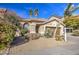 Single-story house with a brown garage door and desert landscaping at 4714 E Paso Trl, Phoenix, AZ 85050