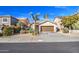 Front view of a single-story house with a brown garage door and landscaped yard at 4714 E Paso Trl, Phoenix, AZ 85050