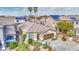 Beautiful single-Gathering home features a well-maintained desert front yard, tall palms and a brown two-car garage at 4714 E Paso Trl, Phoenix, AZ 85050