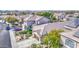 Tan single-Gathering home with a well-maintained desert front yard and a brown two-car garage in a residential area at 4714 E Paso Trl, Phoenix, AZ 85050
