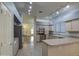 Open kitchen with island and stainless steel appliances at 4714 E Paso Trl, Phoenix, AZ 85050