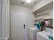 Laundry room with washer, dryer, and storage shelves at 4714 E Paso Trl, Phoenix, AZ 85050