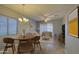 Open-concept living room featuring tile floors, a dining area, comfortable seating, and ample natural light at 4714 E Paso Trl, Phoenix, AZ 85050