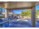 Covered patio with built-in grill and hanging light at 4714 E Paso Trl, Phoenix, AZ 85050