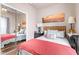 Well-lit bedroom with a mirror and a bed at 5201 W Camelback Rd # F316, Phoenix, AZ 85031