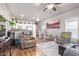 Open concept dining area with kitchen access and wood floors at 5201 W Camelback Rd # F316, Phoenix, AZ 85031