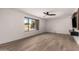 Bright bedroom with wood-look floors and large window at 6414 E Sheridan St, Scottsdale, AZ 85257