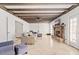 Living room with a fireplace, exposed beams, and comfortable seating at 6550 N 7Th St, Phoenix, AZ 85014