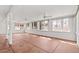 Sunroom with terracotta floors and ceiling fan at 6550 N 7Th St, Phoenix, AZ 85014