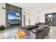 Modern living room with fireplace and large TV at 6931 E Stevens Rd, Cave Creek, AZ 85331