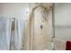 Clean shower with tile surround and glass enclosure at 7129 E Broadway Rd # 73, Mesa, AZ 85208