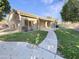 House with grassy backyard, walkway, and covered patio at 741 N Tower Pl, Chandler, AZ 85225