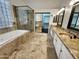 Spa-like bathroom with soaking tub, walk-in shower, and double vanity at 741 N Tower Pl, Chandler, AZ 85225