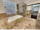 Bathroom featuring a large soaking tub and walk-in shower at 741 N Tower Pl, Chandler, AZ 85225