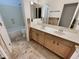 Bathroom with double vanity and beige tile floors at 741 N Tower Pl, Chandler, AZ 85225