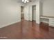 Bedroom with hardwood floors, closet, and built-in desk at 741 N Tower Pl, Chandler, AZ 85225