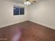 Simple bedroom with hardwood floors and ceiling fan at 741 N Tower Pl, Chandler, AZ 85225
