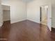 Well-lit bedroom with hardwood floors and walk-in closet at 741 N Tower Pl, Chandler, AZ 85225