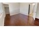 Light and airy bedroom with wood floors and access to bathroom at 741 N Tower Pl, Chandler, AZ 85225