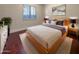 Light and airy bedroom with hardwood floors and a modern bed at 741 N Tower Pl, Chandler, AZ 85225