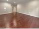 Spacious bedroom with hardwood floors and access to hallway at 741 N Tower Pl, Chandler, AZ 85225