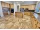 Kitchen with island, granite counters & built-in oven at 741 N Tower Pl, Chandler, AZ 85225