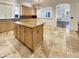 Kitchen features granite island, stainless steel appliances, and tile floors at 741 N Tower Pl, Chandler, AZ 85225