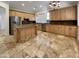 Kitchen boasts granite island, stainless steel appliances, and tile floors at 741 N Tower Pl, Chandler, AZ 85225