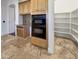 Kitchen with double oven, pantry and wine rack at 741 N Tower Pl, Chandler, AZ 85225