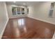 Spacious living room with hardwood floors and large windows at 741 N Tower Pl, Chandler, AZ 85225