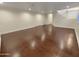Spacious living room with hardwood floors and a staircase at 741 N Tower Pl, Chandler, AZ 85225