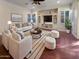 Spacious living room with hardwood floors and built-in entertainment center at 741 N Tower Pl, Chandler, AZ 85225