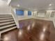 Bright living room featuring hardwood floors and built-in shelving at 741 N Tower Pl, Chandler, AZ 85225