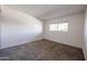 Condo bedroom with neutral carpeting and a window at 7436 E Chaparral Rd # B260, Scottsdale, AZ 85250
