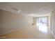 Bright condo living room with hardwood floors and sliding doors at 7436 E Chaparral Rd # B260, Scottsdale, AZ 85250