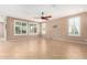 Spacious living room with tile flooring and plantation shutters at 7517 W Noble Prairie Way, Florence, AZ 85132