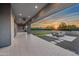 Beautiful outdoor patio with a fireplace, modern seating, and an outdoor kitchen, perfect for relaxing and entertaining at 8110 E Saddle Horn Rd, Scottsdale, AZ 85255