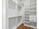 Organized walk-in closet with multiple shelves and drawers, offering ample storage space at 8110 E Saddle Horn Rd, Scottsdale, AZ 85255