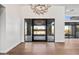 Inviting foyer featuring hardwood floors and a direct view through modern glass doors at 8110 E Saddle Horn Rd, Scottsdale, AZ 85255