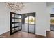 Bright foyer with a modern chandelier and a view of the desert landscape at 8110 E Saddle Horn Rd, Scottsdale, AZ 85255