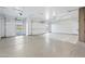 Spacious garage with epoxy flooring, multiple doors, and high ceilings, ready for customization at 8110 E Saddle Horn Rd, Scottsdale, AZ 85255
