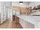 Beautiful kitchen with stainless steel appliances, marble countertops, and light wood floors at 8110 E Saddle Horn Rd, Scottsdale, AZ 85255