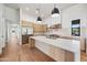 Contemporary kitchen with stainless steel appliances, marble counters, and wooden accents at 8110 E Saddle Horn Rd, Scottsdale, AZ 85255