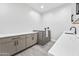 This utility room features a pet washing station and built in cabinets and counters at 8110 E Saddle Horn Rd, Scottsdale, AZ 85255