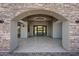 Luxury home port cochere featuring stone accents, modern lighting, and a stunning interior view at 8110 E Saddle Horn Rd, Scottsdale, AZ 85255