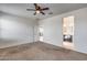 Bright bedroom with carpet flooring and ceiling fan at 8506 S 256Th Dr, Buckeye, AZ 85326