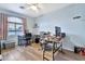 Spacious home office with L-shaped desk and window at 9230 E Fairfield St, Mesa, AZ 85207