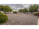 Large backyard with gravel and mature trees at 10027 W Concord Ave, Sun City, AZ 85351