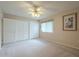 Spacious bedroom with window and ceiling fan at 10027 W Concord Ave, Sun City, AZ 85351